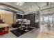 Bright open space with concrete ceilings, a functional desk area, and a glimpse of the dining room at 2100 16Th St # 606, Denver, CO 80202