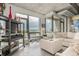 Contemporary living room featuring an open layout and expansive city views through large windows at 2100 16Th St # 606, Denver, CO 80202