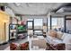 Stylish living room with cityscape views from floor-to-ceiling windows at 2100 16Th St # 606, Denver, CO 80202