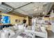 Open-concept living room featuring modern furnishings, chandelier, and view of adjacent kitchen at 2100 16Th St # 606, Denver, CO 80202