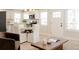 Open-concept living space integrates seamlessly with a bright kitchen, providing a harmonious and functional area at 3728 W Exposition Ave, Denver, CO 80219