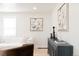 Living room with neutral decor, modern furniture, stylish art, and light wood floors creating a cozy and inviting space at 3728 W Exposition Ave, Denver, CO 80219