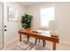 Bright office with a wooden desk, neutral decor, and modern accents, creating a productive and stylish work environment at 3728 W Exposition Ave, Denver, CO 80219