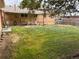 Spacious backyard featuring a covered patio and lush green grass, perfect for outdoor entertaining and relaxation at 11937 Claude Ct, Northglenn, CO 80233