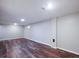 Spacious basement area with vinyl plank flooring, offering versatility and ample room at 11937 Claude Ct, Northglenn, CO 80233