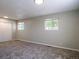 A bright bedroom offers neutral paint, new carpet, and a double door closet at 11937 Claude Ct, Northglenn, CO 80233