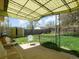A covered patio with wrought iron and an open view of the backyard at 11937 Claude Ct, Northglenn, CO 80233