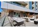 Stylish balcony featuring an outdoor dining and lounge area with sleek furniture and modern design elements at 4200 W 17Th Ave # 223, Denver, CO 80204