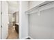 Walk-in closet adjacent to an attached bathroom at 4200 W 17Th Ave # 223, Denver, CO 80204
