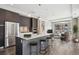 Modern kitchen with stainless steel appliances, kitchen island with barstool seating, and an open floor plan at 4200 W 17Th Ave # 223, Denver, CO 80204