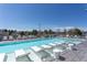A rooftop pool and lounge area under a clear blue sky offer relaxation and scenic views from the deck at 4200 W 17Th Ave # 223, Denver, CO 80204