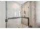 Modern shower featuring sleek fixtures, tiled walls, and glass door at 4200 W 17Th Ave # 223, Denver, CO 80204
