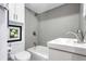 Compact bathroom featuring modern fixtures, including a white toilet, sink, and a bathtub-shower combination at 21531 Main Ave, Golden, CO 80401