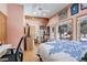 Bright bedroom with hardwood floors, a ceiling fan, and a large window at 21531 Main Ave, Golden, CO 80401
