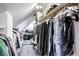 Walk-in closet featuring ample hanging space with organized clothing and overhead lighting at 21531 Main Ave, Golden, CO 80401