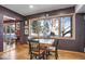 Cozy dining area with wood table and chairs, overlooking wooded area at 21531 Main Ave, Golden, CO 80401