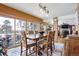 Bright dining room with sliding doors to patio and wood dining table at 21531 Main Ave, Golden, CO 80401