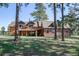 Spacious home with a large front yard, surrounded by mature trees offering shade and privacy at 21531 Main Ave, Golden, CO 80401