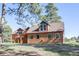 Charming home featuring a wooden exterior, well-manicured lawn and beautiful windows at 21531 Main Ave, Golden, CO 80401