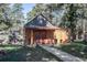 Charming backyard shed with double doors, offering functional space and a quaint addition to the property at 21531 Main Ave, Golden, CO 80401