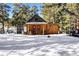 Charming guest house with snow covered yard at 21531 Main Ave, Golden, CO 80401