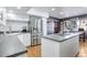 Modern kitchen with stainless steel appliances, white cabinets, gas cooktop and sleek countertops at 21531 Main Ave, Golden, CO 80401