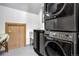 Convenient laundry room with modern, stacked washer and dryer at 21531 Main Ave, Golden, CO 80401