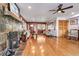 Hardwood floors, fireplace, and a view into the dining room at 21531 Main Ave, Golden, CO 80401