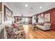Cozy living room boasting a stone fireplace, hardwood floors, and a sliding glass door at 21531 Main Ave, Golden, CO 80401