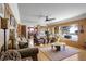 Spacious living room with hardwood floors, large windows, and a cozy fireplace at 21531 Main Ave, Golden, CO 80401