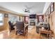Bright and airy living room with hardwood floors, fireplace and large windows overlooking trees at 21531 Main Ave, Golden, CO 80401