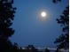 Stunning night view of city lights and moon at 21531 Main Ave, Golden, CO 80401