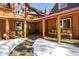 Inviting covered porch with stone patio and wooden seating at 21531 Main Ave, Golden, CO 80401