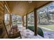 Cozy porch with log columns and comfortable rocking chairs overlooking the yard at 21531 Main Ave, Golden, CO 80401