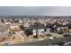Aerial view of a neighborhood featuring well-maintained homes with fenced yards and paved streets at 24747 E Calhoun Pl # C, Aurora, CO 80016