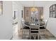 Dining area with a stylish chandelier and decor, conveniently located near other rooms of the house at 24747 E Calhoun Pl # C, Aurora, CO 80016