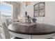 Close up shot of an elegant dining table with decorative centerpieces under a window with natural light at 24747 E Calhoun Pl # C, Aurora, CO 80016
