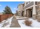 Charming two-story home with stone accents, covered porch, and landscaped walkway at 24747 E Calhoun Pl # C, Aurora, CO 80016