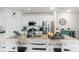 Bright kitchen with granite countertops, stainless steel appliances, and white cabinetry at 24747 E Calhoun Pl # C, Aurora, CO 80016