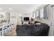 Comfortable living room with a plush sectional sofa, hardwood floors, and natural light at 24747 E Calhoun Pl # C, Aurora, CO 80016