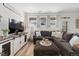 Bright living area with a cozy sectional sofa, large TV, and stylish decor, perfect for relaxing at 24747 E Calhoun Pl # C, Aurora, CO 80016