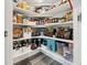 Walk-in pantry with ample shelving and storage space for food and supplies at 24747 E Calhoun Pl # C, Aurora, CO 80016