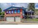 Brick home with a spacious two-car garage and attached gazebo at 209 10Th Ave, Idaho Springs, CO 80452