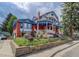 Charming home featuring a colorful exterior and landscaped garden at 209 10Th Ave, Idaho Springs, CO 80452