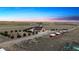 Aerial view of a sprawling estate, barns, pastures, and stunning sunset backdrop at 12565 Picadilly Rd, Commerce City, CO 80022