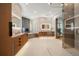Elegant bathroom featuring dual sinks, soaking tub, a walk-in glass shower, and tasteful modern design at 12565 Picadilly Rd, Commerce City, CO 80022