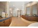 Beautiful bathroom with dual sinks, a glass shower, and modern finishes offering a spa-like experience at 12565 Picadilly Rd, Commerce City, CO 80022