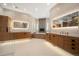 Bright bathroom with dual vanities, a soaking tub, and a separate glass shower for a spa-like retreat at 12565 Picadilly Rd, Commerce City, CO 80022