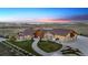 Custom home featuring sprawling acreage, meticulous landscaping, and an oversized garage at 12565 Picadilly Rd, Commerce City, CO 80022