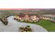 Expansive estate boasting meticulous landscaping, and impressive stone and stucco detailing at 12565 Picadilly Rd, Commerce City, CO 80022